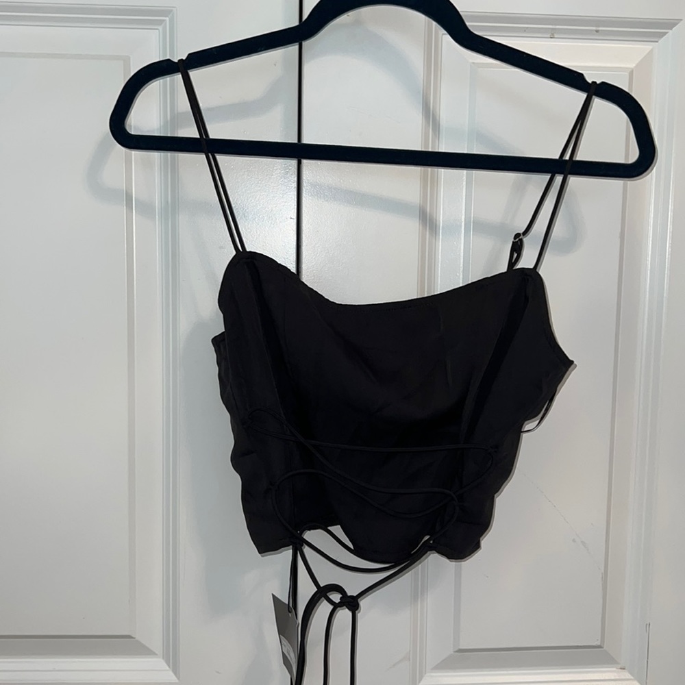 Black going out top with tie in front